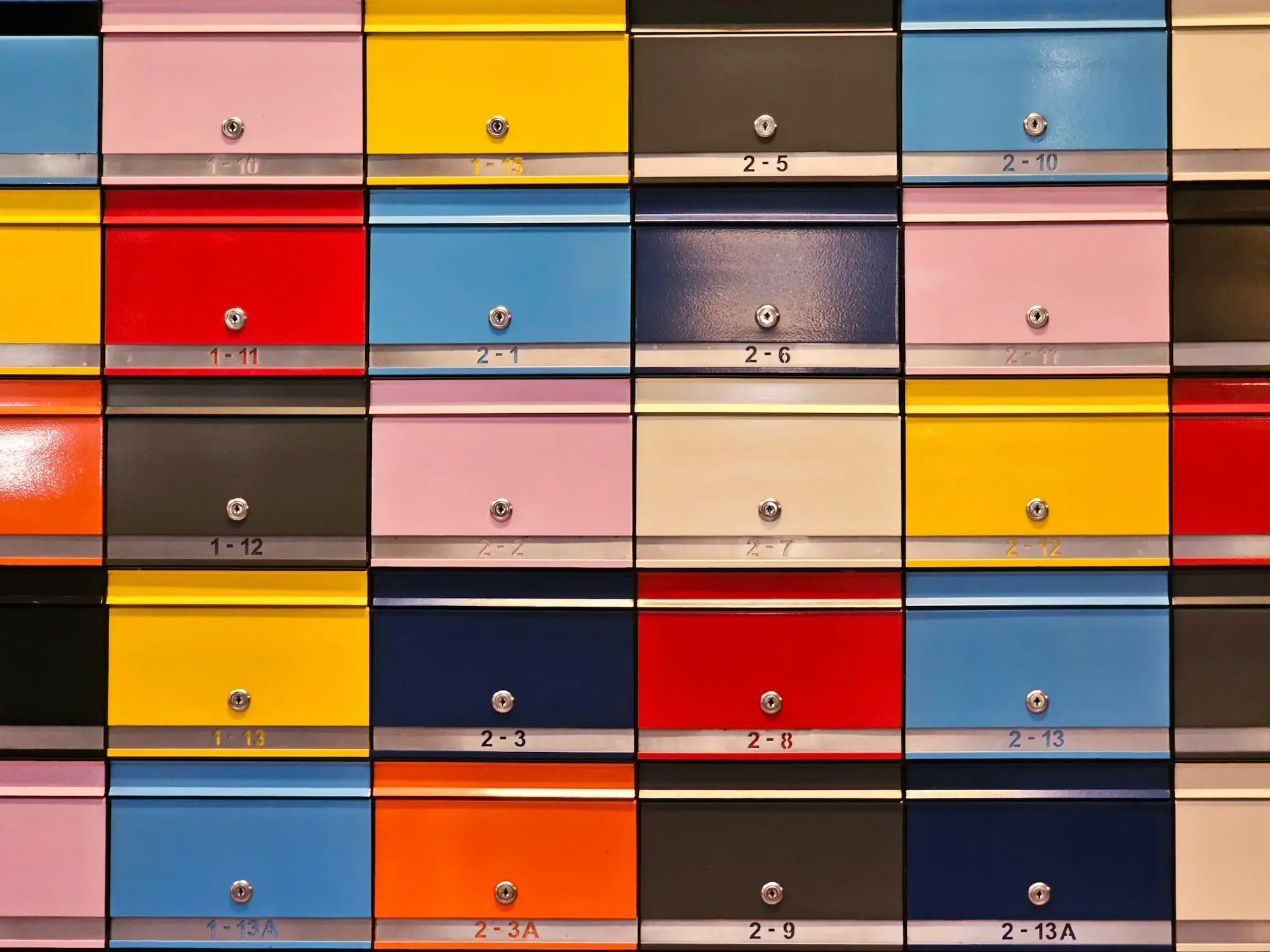 Colorful office mailboxes.